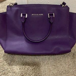 Purple Michael Kors bag.